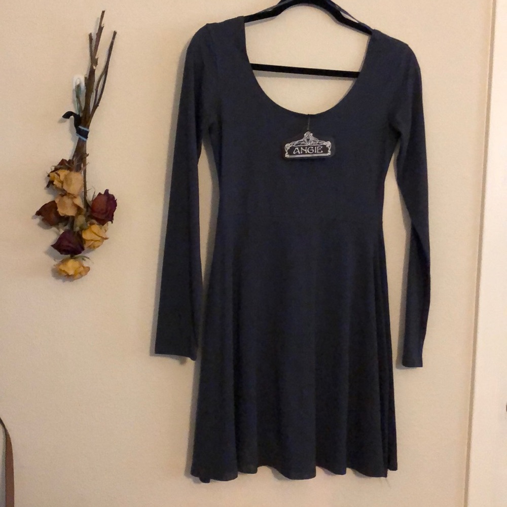 A short to medium long Dark Grey dress.
